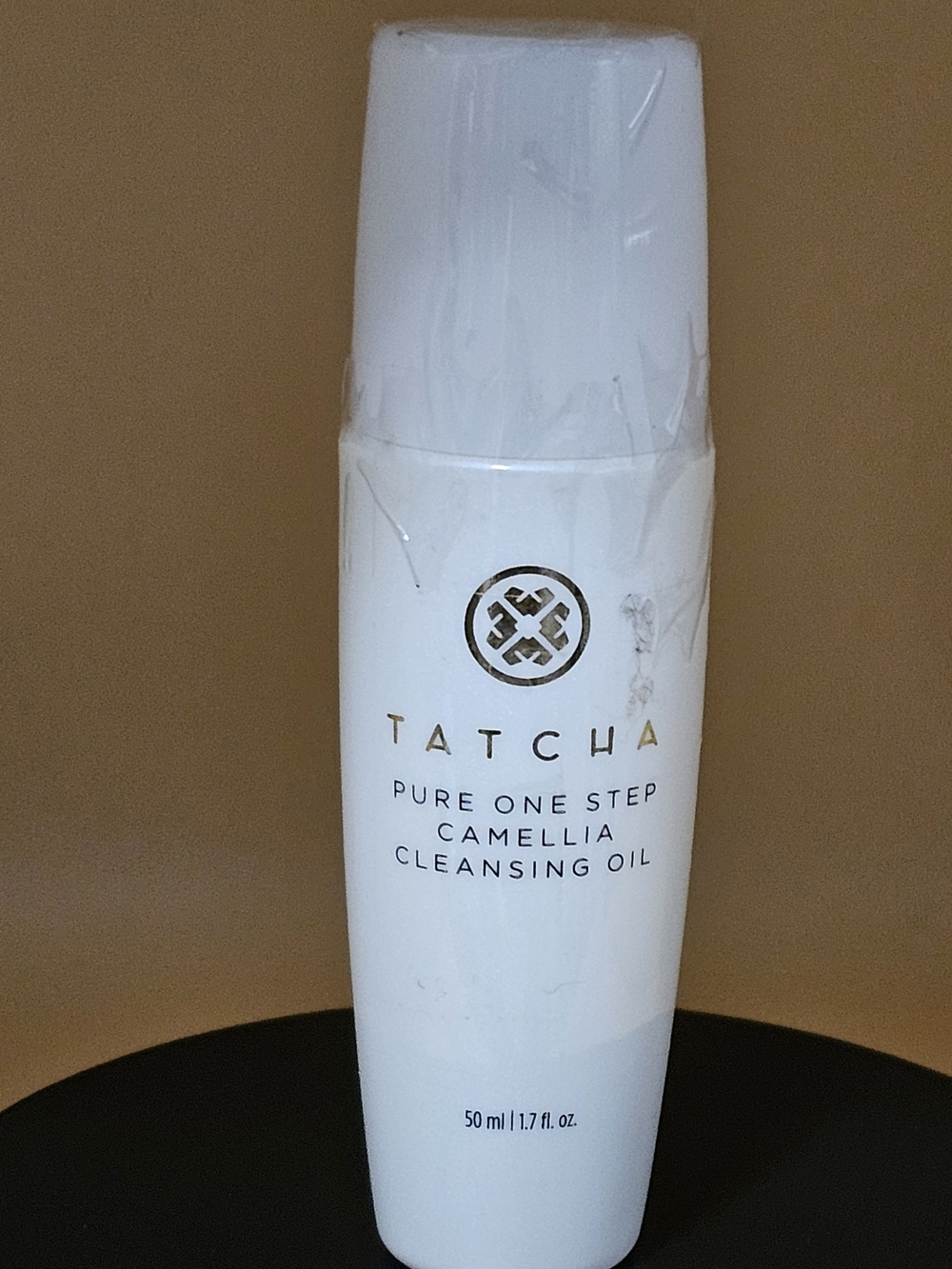 Tatcha White Cleansing Oil Bottle with Gold Logo